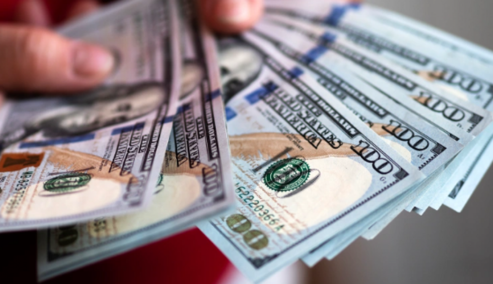 الدولار يهبط لأدنى مستوى بـ10 أيام عقب اتفاق طهران