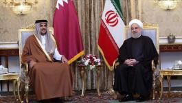 أمير قطر يستقبل الرئيس الإيراني بالدوحة.jpg