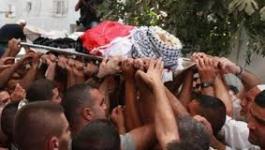 استشهاد طفل فلسطيني نتيجة حصار مخيم اليرموك.jpg