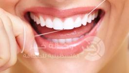 استخدام الخيط لتنظيف الاسنان