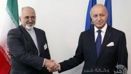 لوران فابيوس ومحمد جواد ظريف 