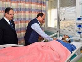 السيسي يزور الضابط الذي احتجزه إرهابيون ويشيد ببطولته.jpg