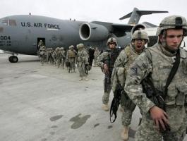 us-soldiers-arrived-from-afghanistan-stand-near-a-plane-at-the-us-airbase-30-km-outside-bishkek-in-manas-air-base