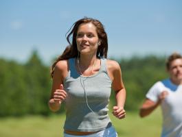 active-couple-headphones-healthy-jogging-man-meadow-music-nature-outdoors-people-running-sport-sportive-spring-summer-two-wellbeing-woman