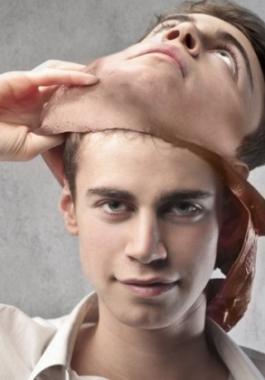 bigstock-Young-man-taking-off-a-mask-31981589-980x498