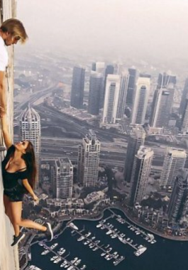 بالفيديو : عارضة روسية تغامر بحياتها من أعلى ابرج دبي من أجل هذا الفيديو