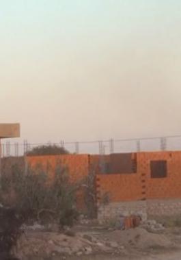 160303012827_people_shelter_from_the_gun_fire_outside_a_house_in_el_aouija_outside_ben_guerdane_640x360_ap_nocredit