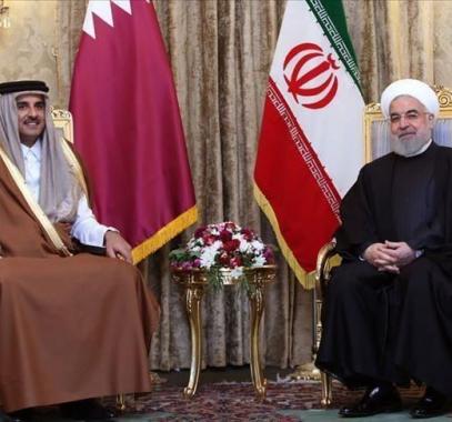 أمير قطر يستقبل الرئيس الإيراني بالدوحة.jpg