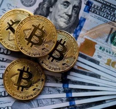 الدولار يستقر والبتكوين تقترب من 28 ألف دولار