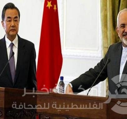 وزير الخارجية الايراني محمد جواد ظريف ونظيره الصيني وانغ يي 