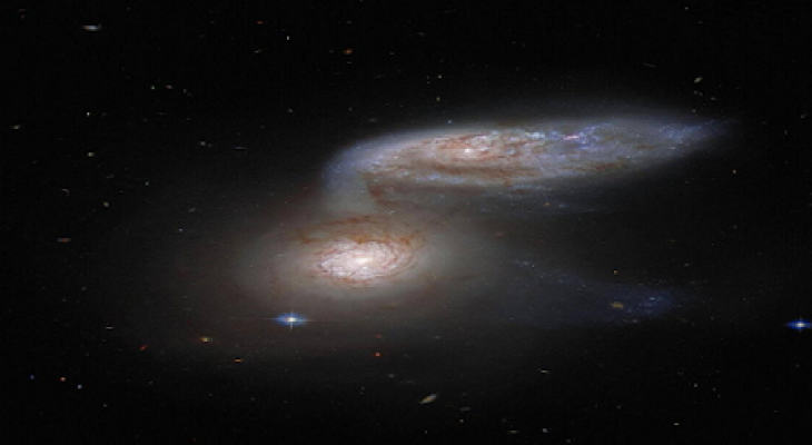 اندماج مجرتين سويا في ظاهرة تحدث مرة كل ملايين السنين