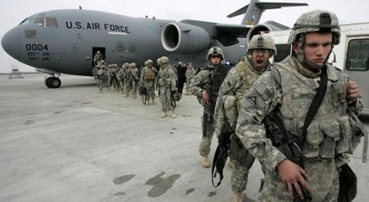 us-soldiers-arrived-from-afghanistan-stand-near-a-plane-at-the-us-airbase-30-km-outside-bishkek-in-manas-air-base