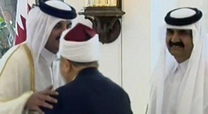 .أمير قطر يستقبل القرضاوي.jpg