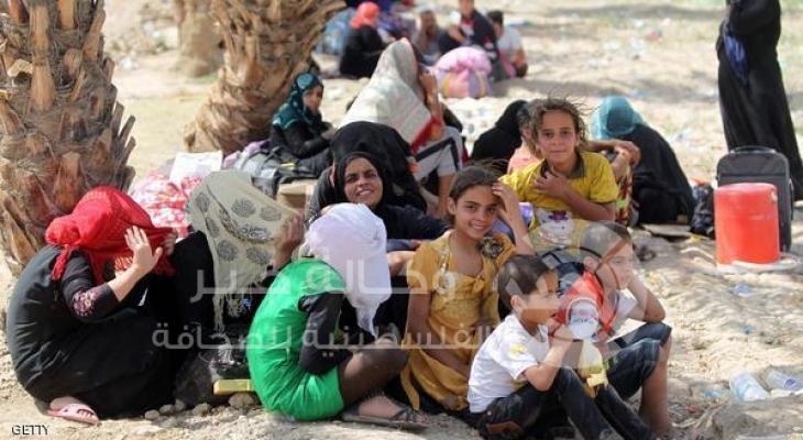 أسر عراقية فرت من مدينة الرمادي على الحدود الجنوبية الغربية لبغداد 