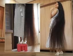 بالفيديو والصور: صاحبة أطول "شعر في العالم".. ساعة لتصفيفه والعناية به